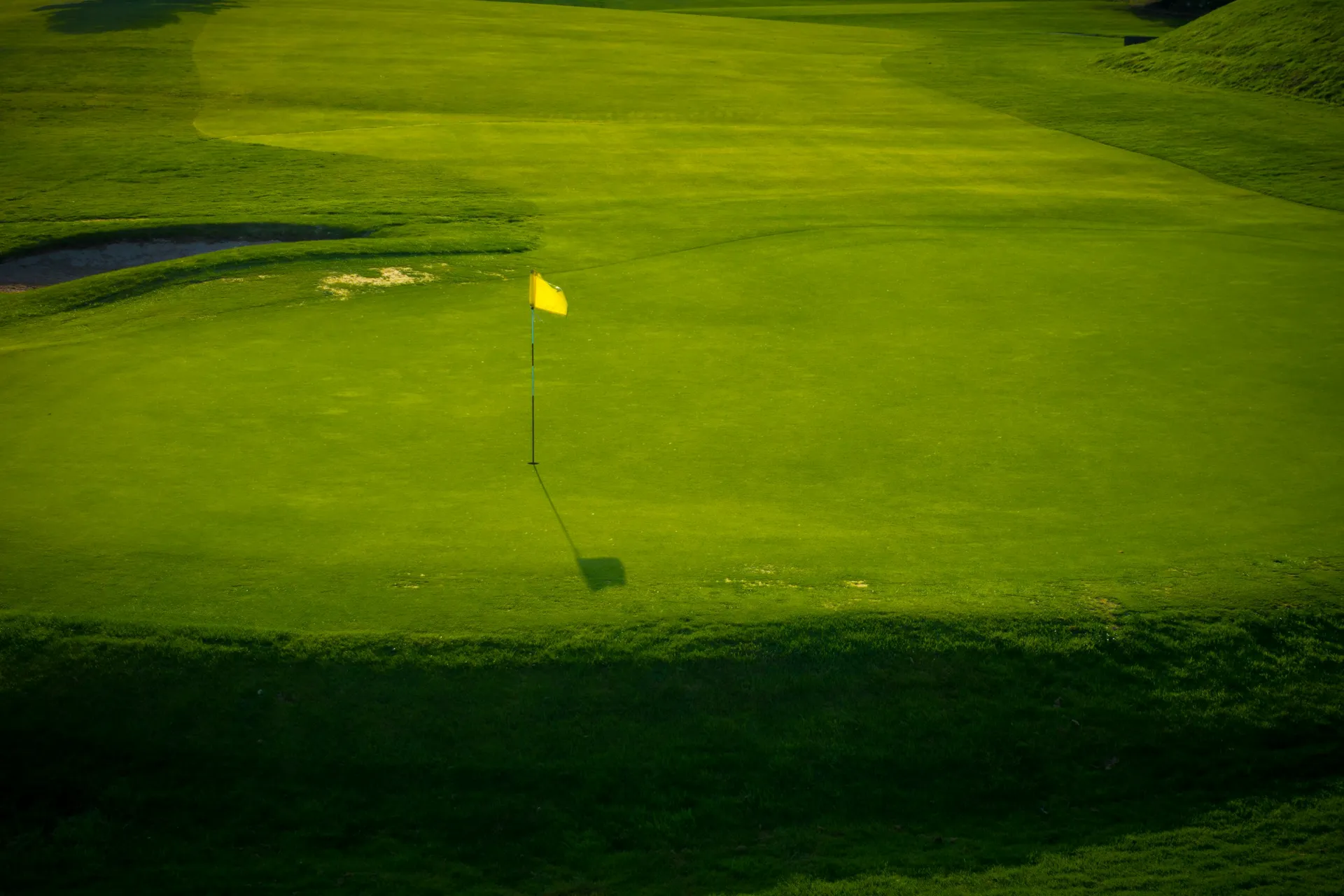 Amen Corner at Augusta National showing the 11th green, 12th tee and green, and 13th fairway from an elevated perspective