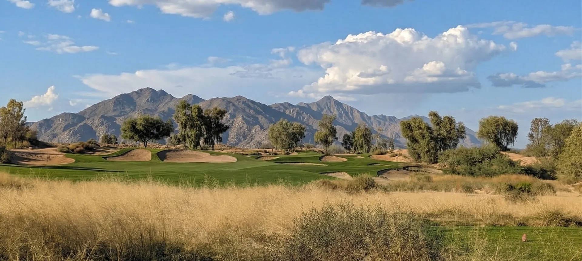 Expansive flashed-face bunkers and sweeping fairways at Ak-Chin Southern Dunes Golf Club with the flat desert horizon beyond, Maricopa, Arizona