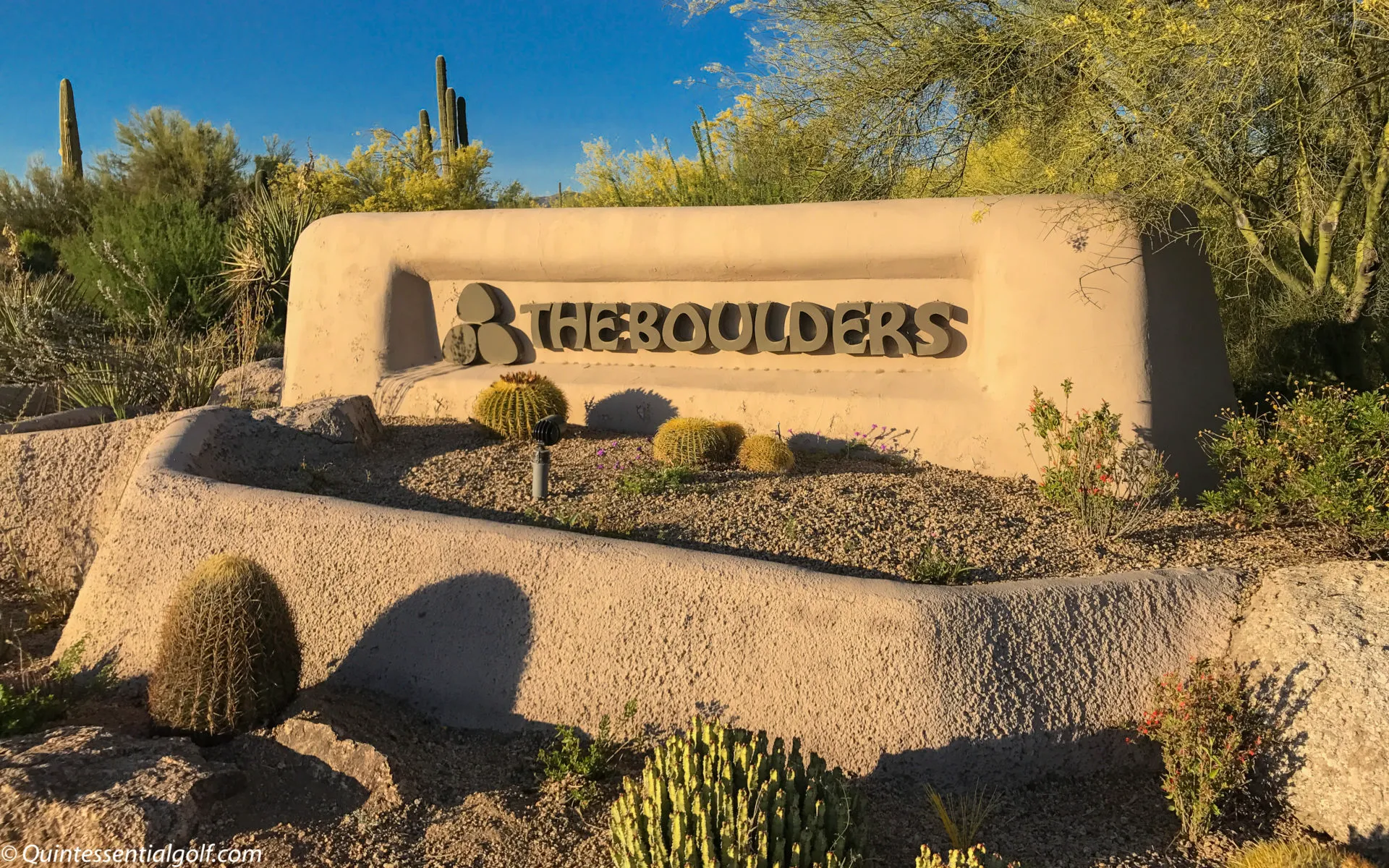 Granite boulder formations towering over a fairway at The Boulders North Course with Sonoran Desert saguaros and Black Mountain in the background, Scottsdale, Arizona