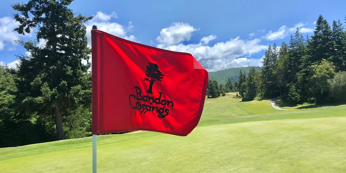 Rolling heathland fairway at Bandon Crossings winding through coastal dunes and forest in southern Oregon