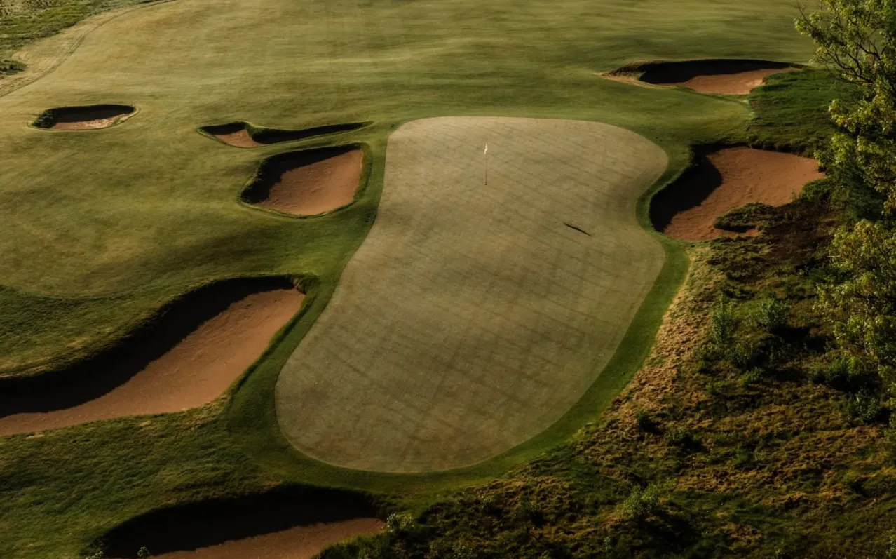 Sedge Valley fairway threading through native grasses and sand dunes at Sand Valley Resort in Wisconsin