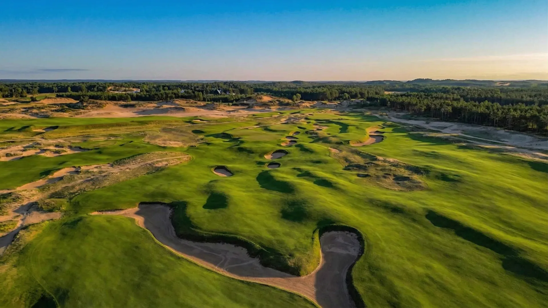 The Lido's massive green complexes and deep cross-bunkers set against the sandy terrain of central Wisconsin