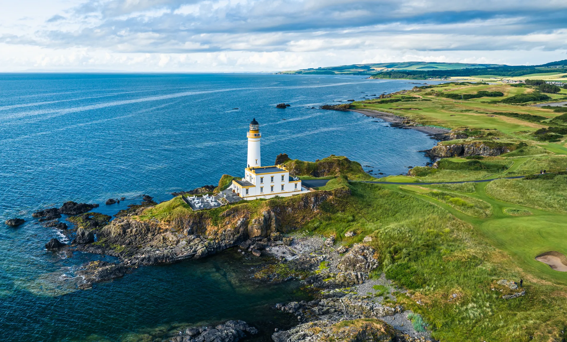 Windswept links fairway along the Ayrshire Coast with the Firth of Clyde and Ailsa Craig visible on the horizon