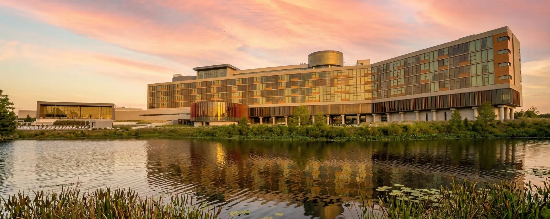 Towering sand ridges and treeless fairways at Streamsong Resort in central Florida, with a walking golfer dwarfed by the former phosphate mine landscape